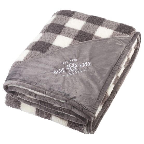 A blanket or throw with a custom logo